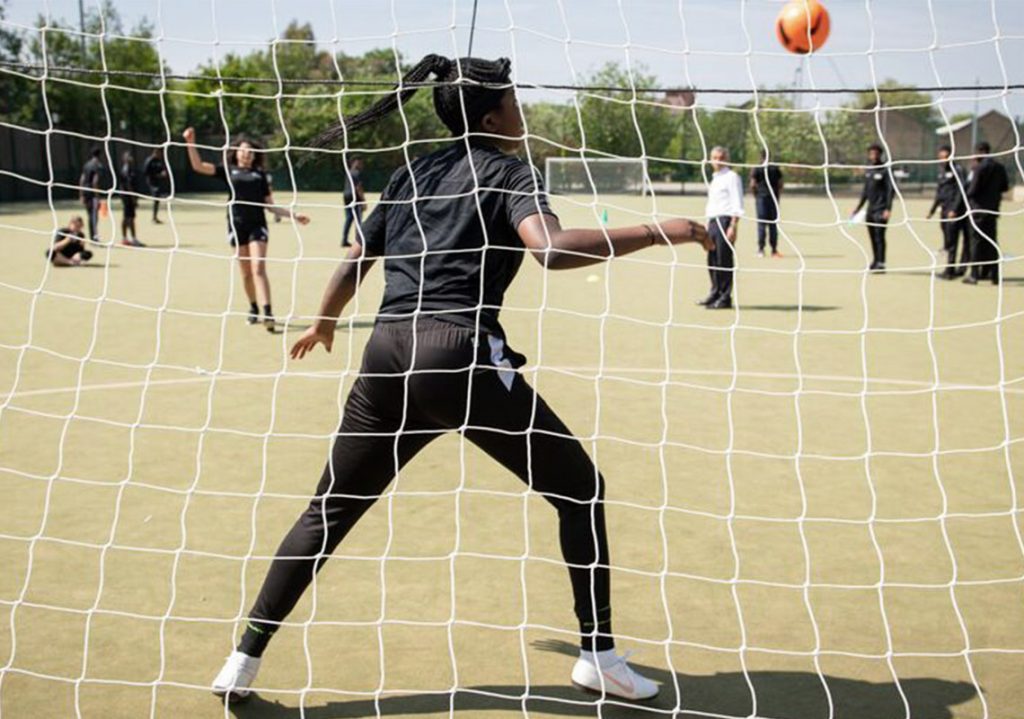 Girls playing football