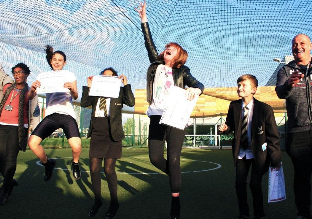 Young people jumping for joy