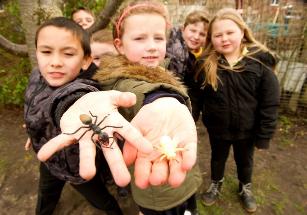 Group of children with bugs