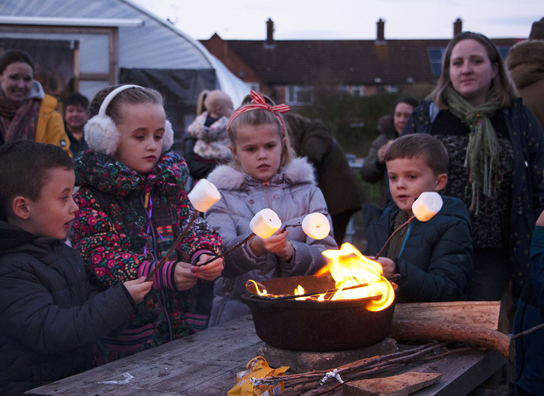 Children toasting marshamallows