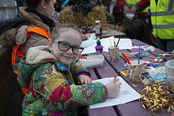 Young girl colouring in a drawing