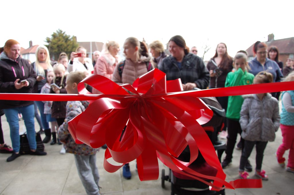 Red ribbon at grand opening