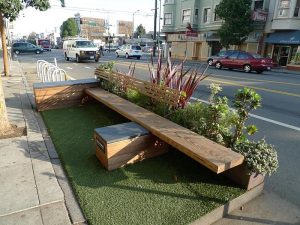 Wooden bench parklet in city