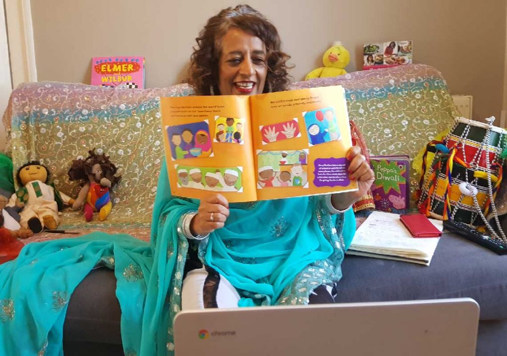 Lady reading children's books over the internet