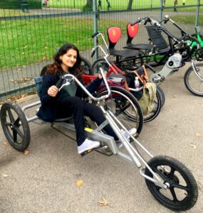 Woman smiling on adapted tricycle