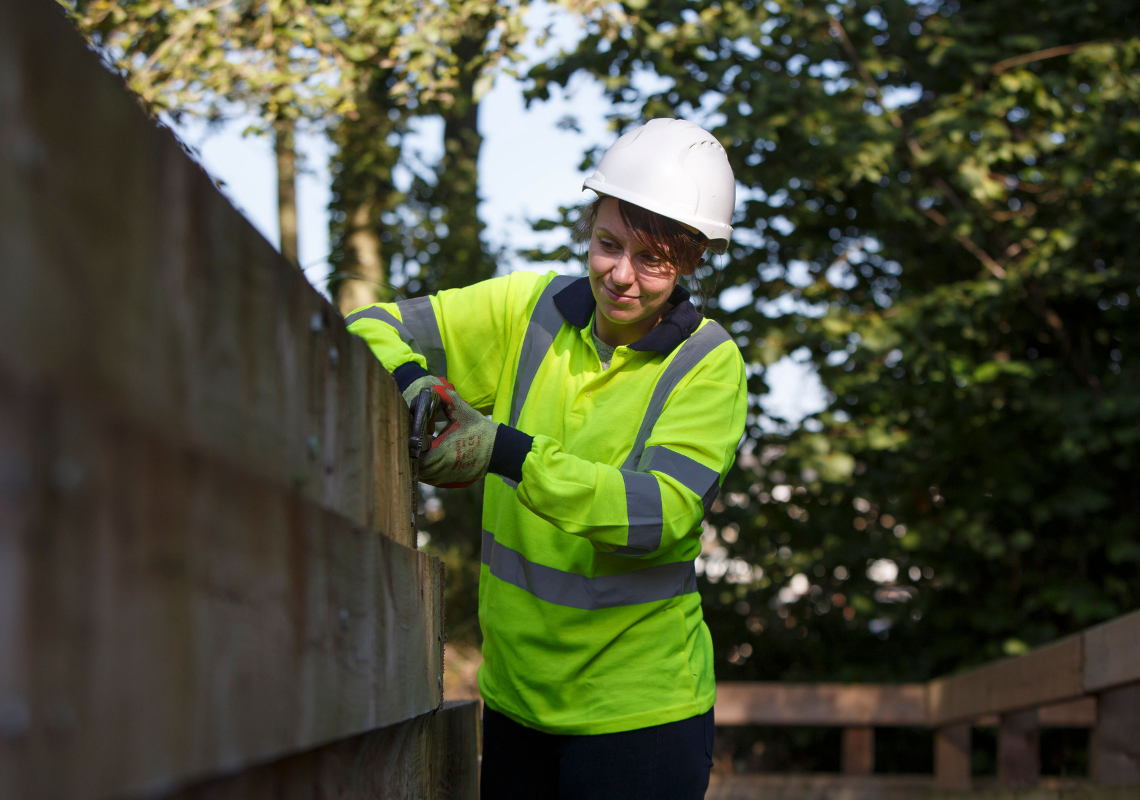 A lady building a wall