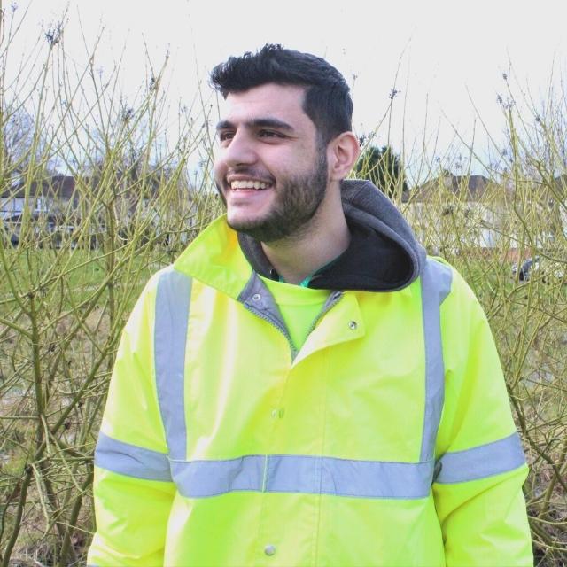 Aqib posing and smiling as part of the Low Carbon Careers course