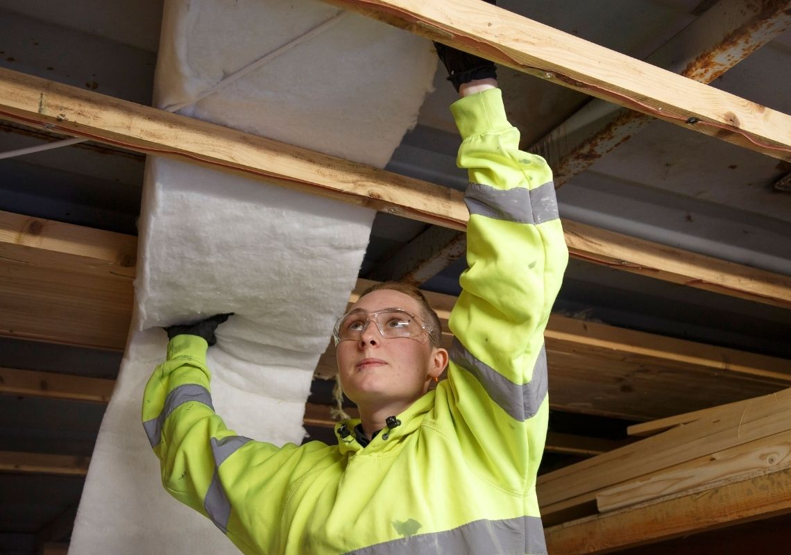 Image showing young person installing insulation