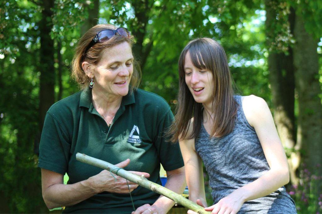 Groundwork staff giving training and advice in an outside setting