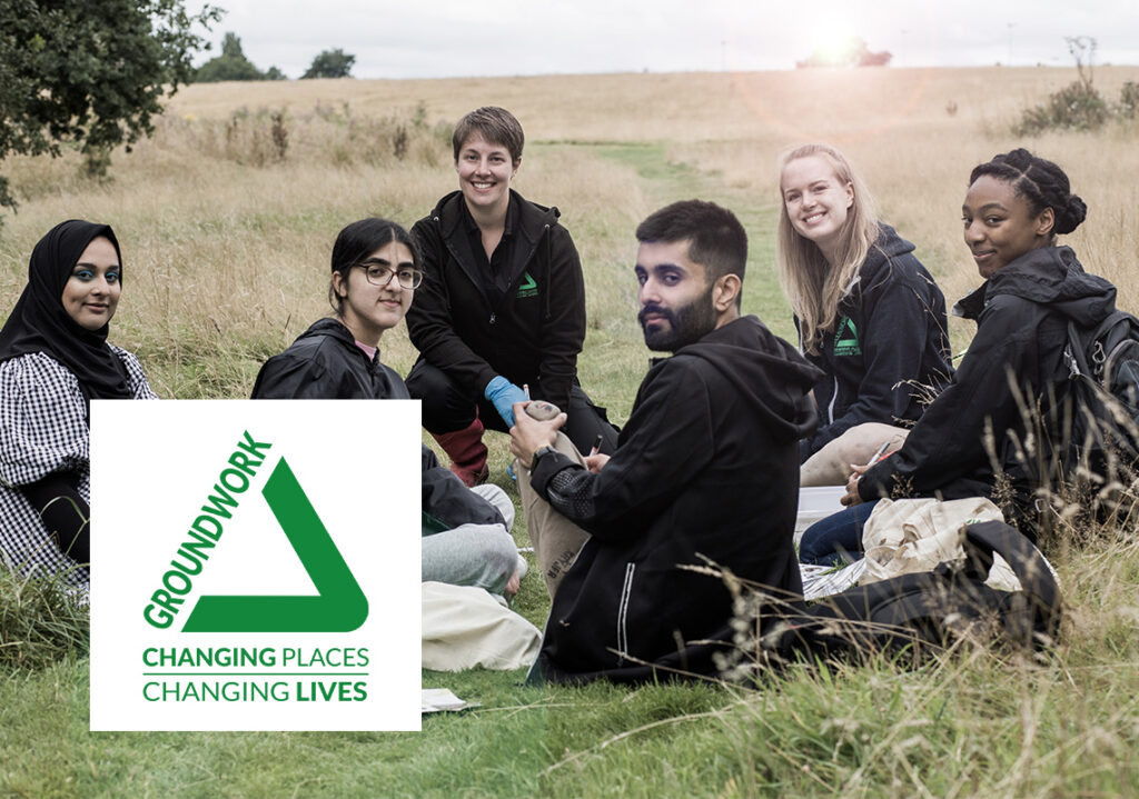 Groundwork staff and young volunteers with Groundwork logo