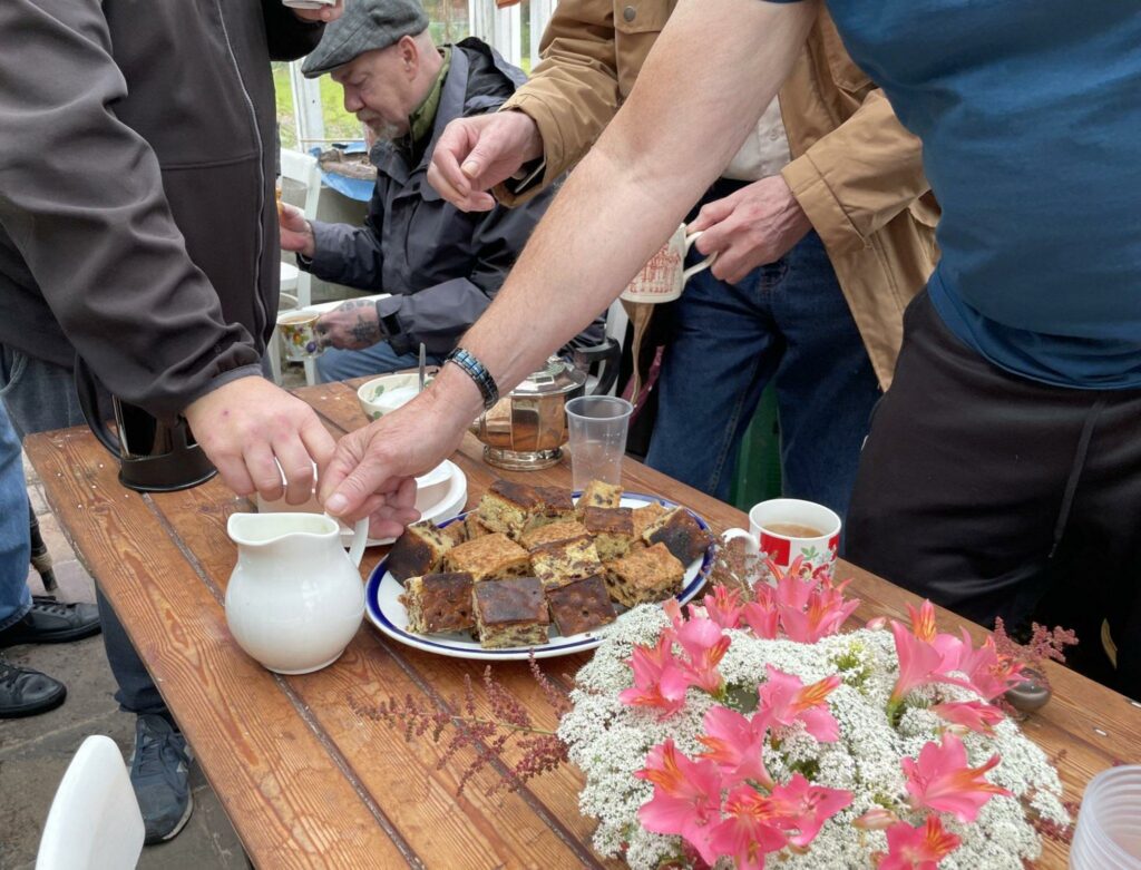 Picnic table with tea and buns