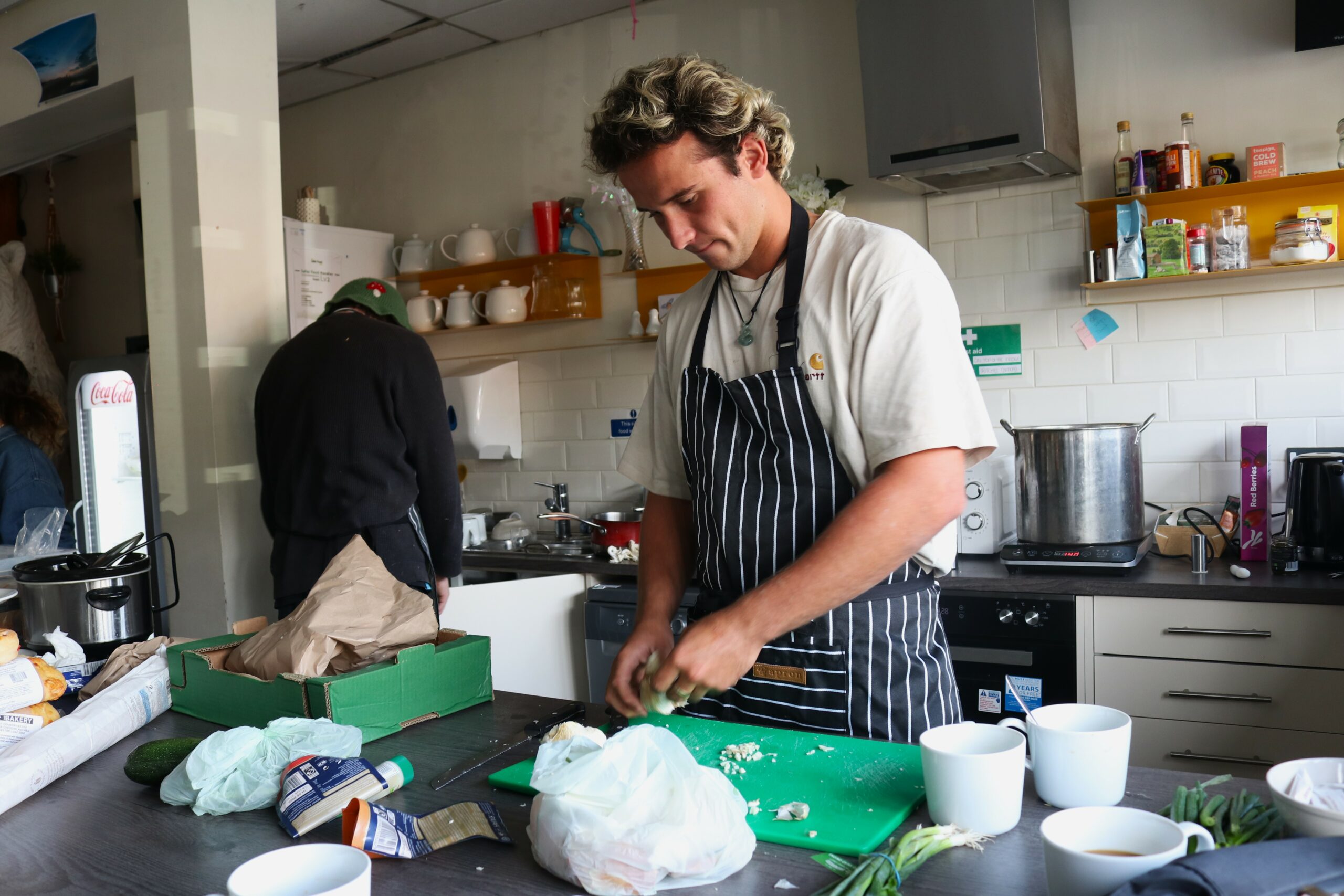 Thomas cooking his home grown food