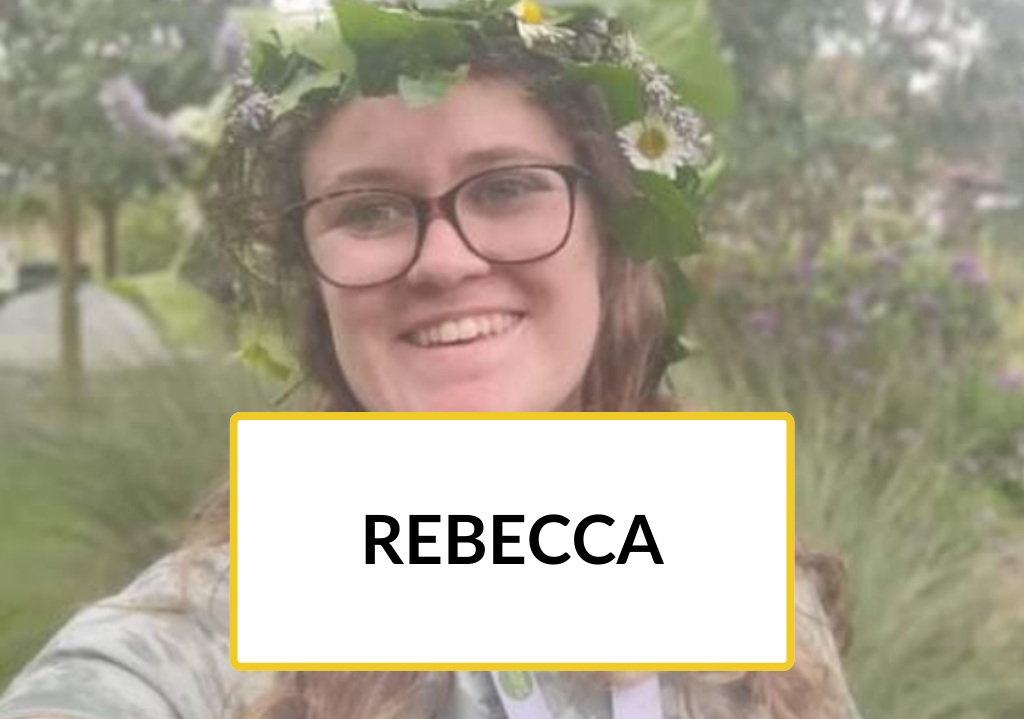 New to Nature Trainee Rebecca smiles outdoors and wears a flower crown.