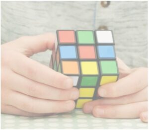 hands holding a rubix cube