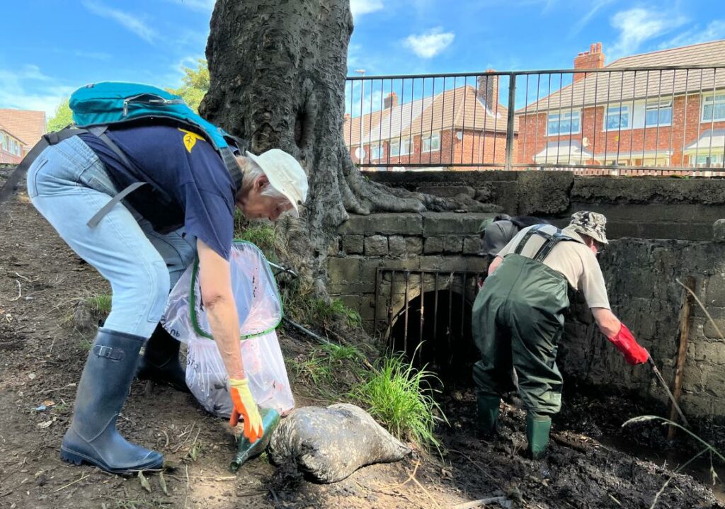 Volunteers litterpicking in the Medlock Valley.