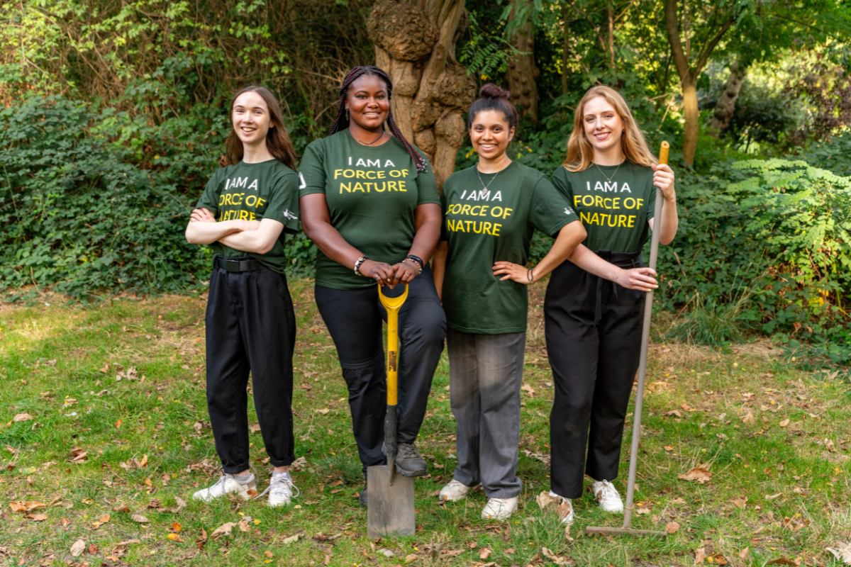 Force of Nature: Photo of four young women holding gardening tools.