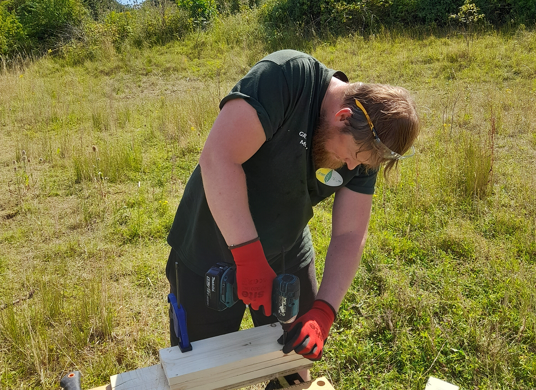 Project participant using work bench outdoors