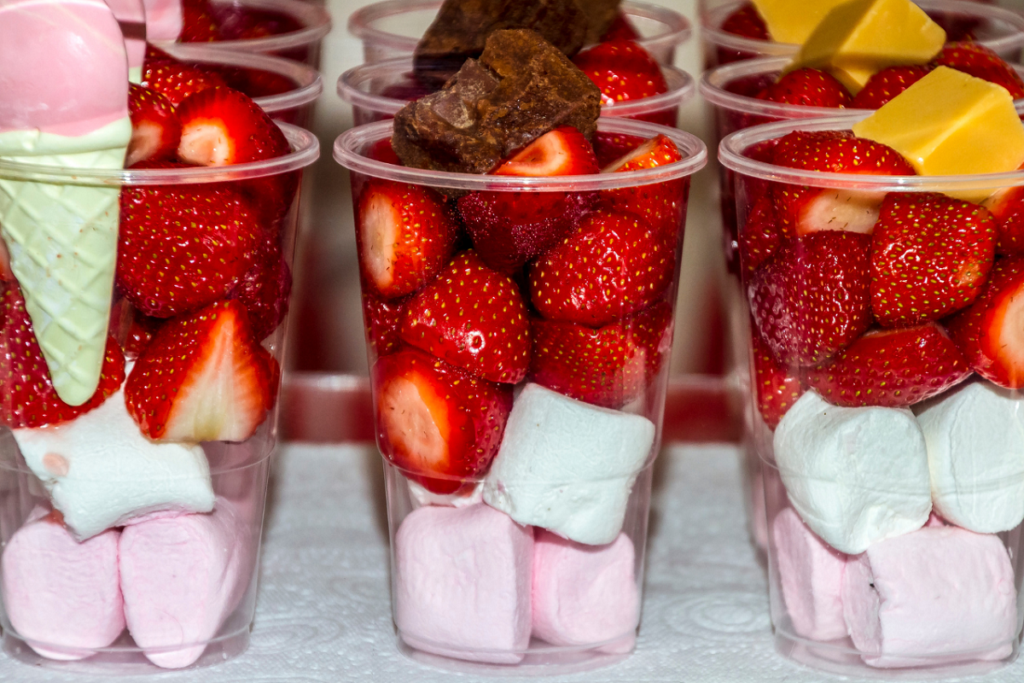 strawberries and marshmallows in glasses as a dessert