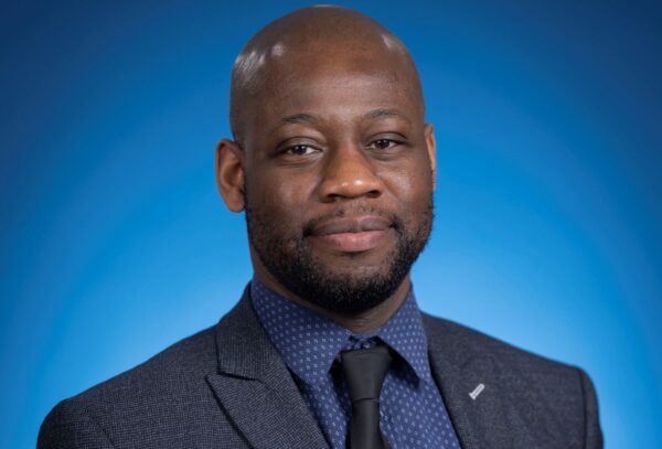 A man posing for a professional photo
