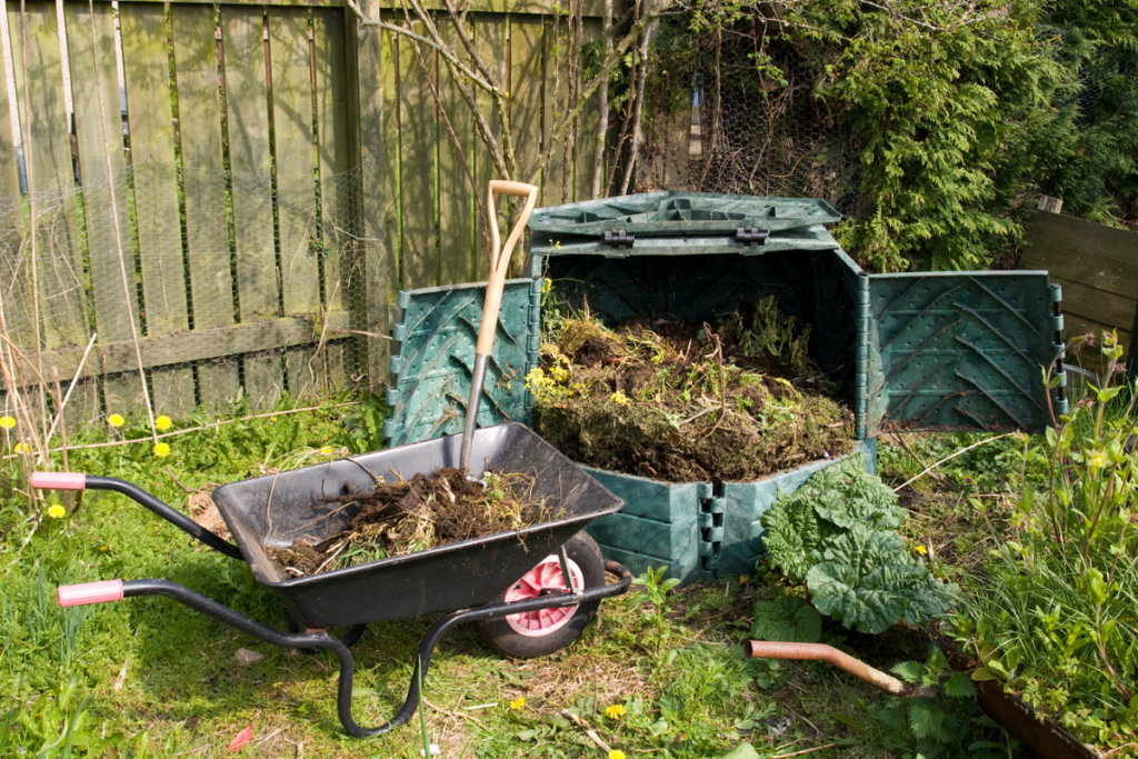 wheel barrow and a compost heap