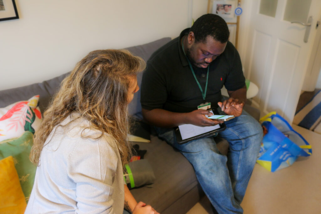 Green Doctor Afele giving energy advice to Andreea