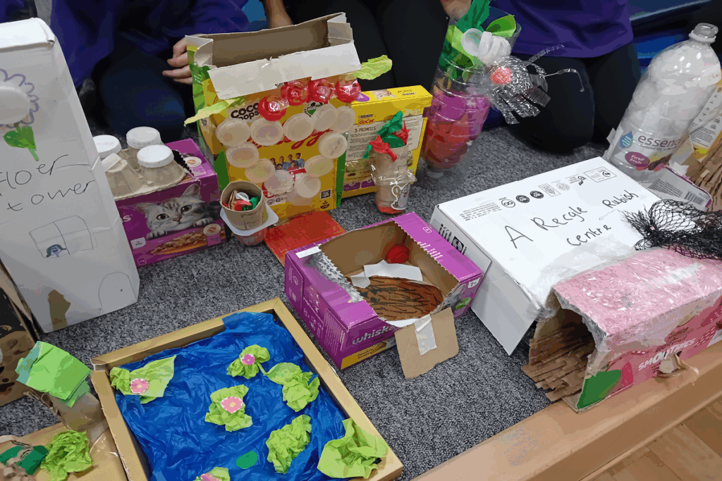 in the classroom, making a recycling centre