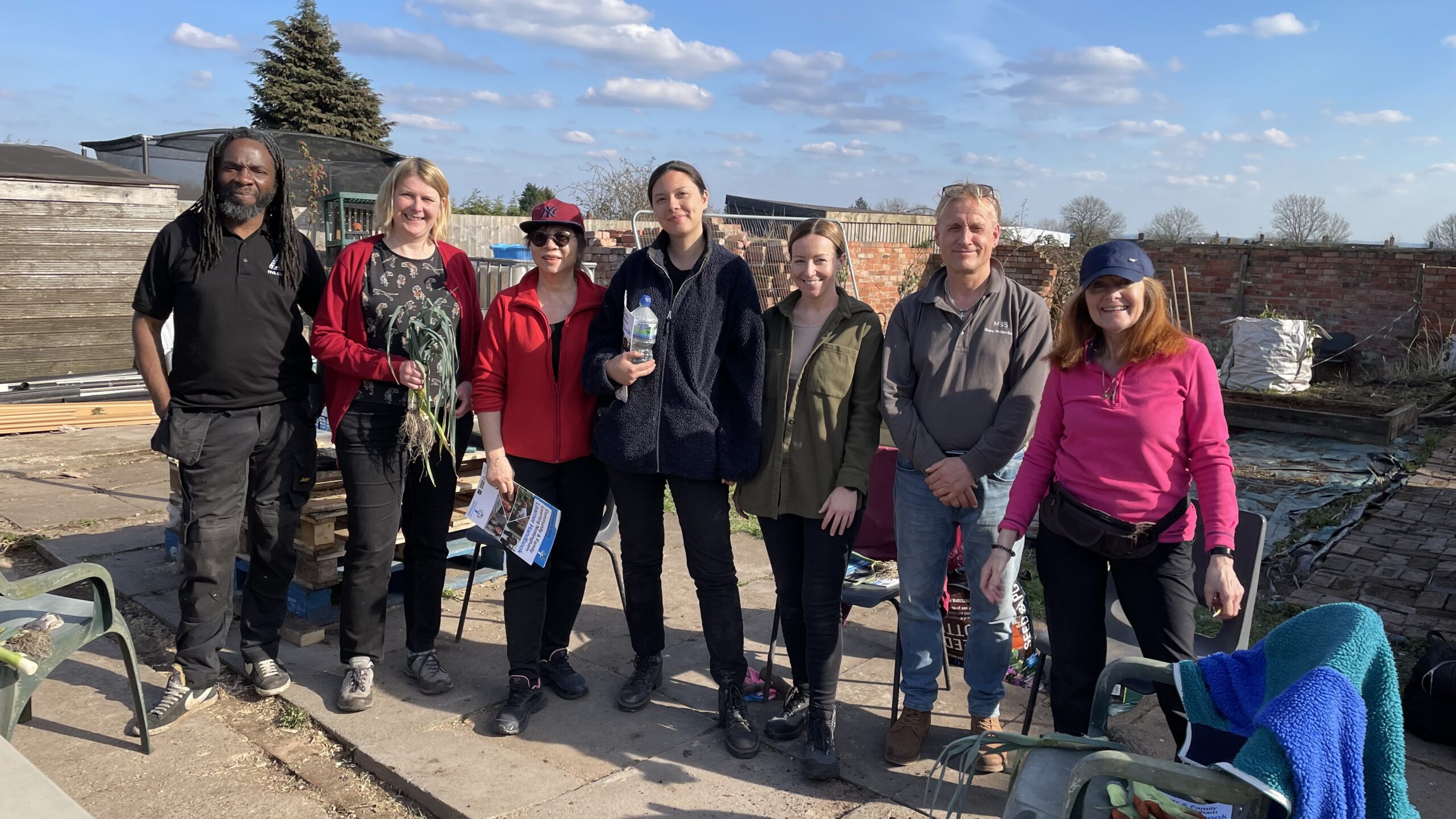 Group of people at Little Walled Garden, an allotment space.