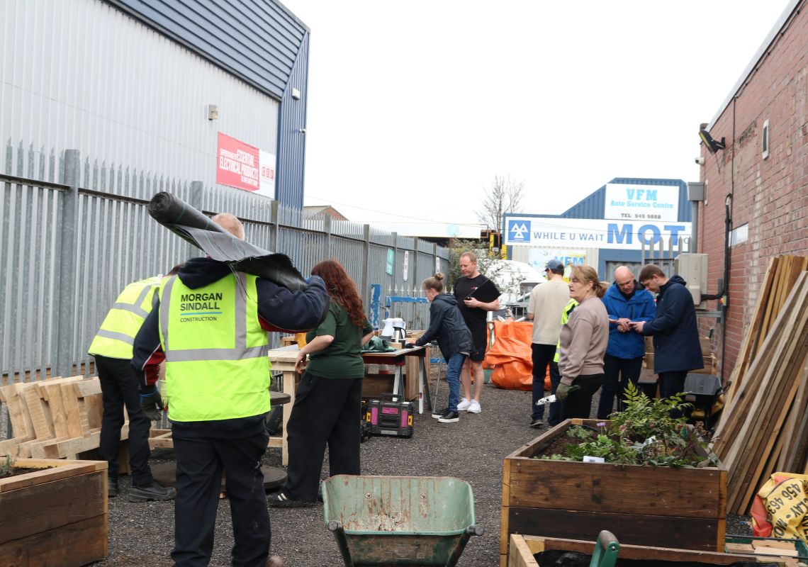 Volunteers creating the community garden