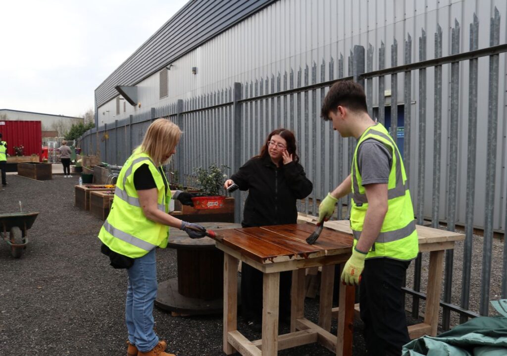 Lucy with some volunteers during a workshop