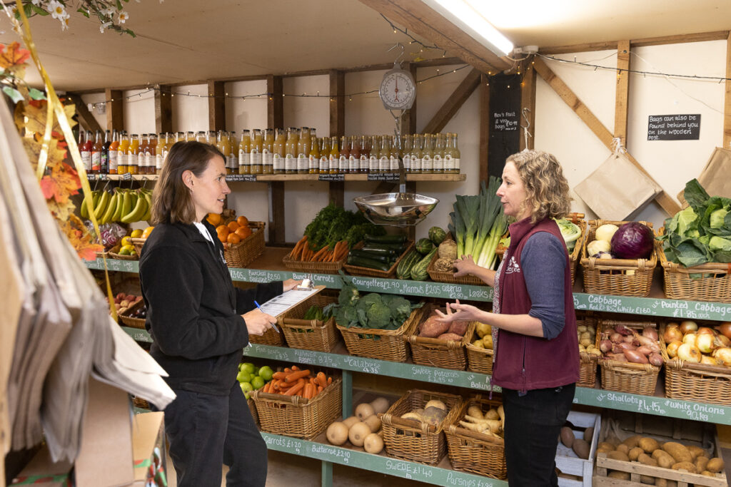 Groundwork staff and business owner chatting on site
