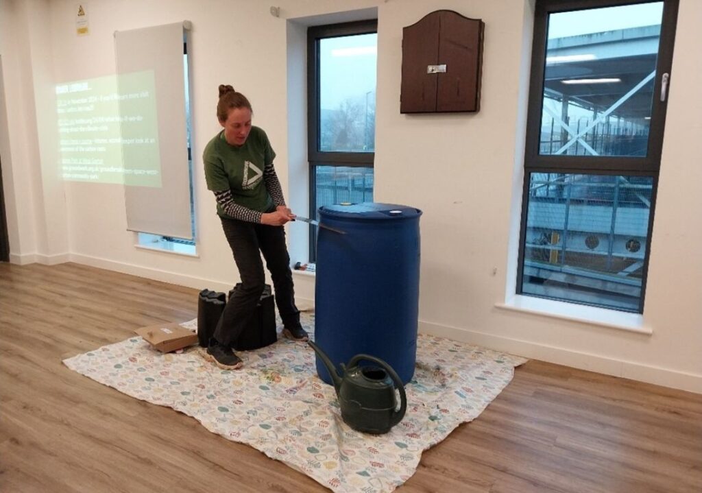 Groundwork staff showing how to use a water butt