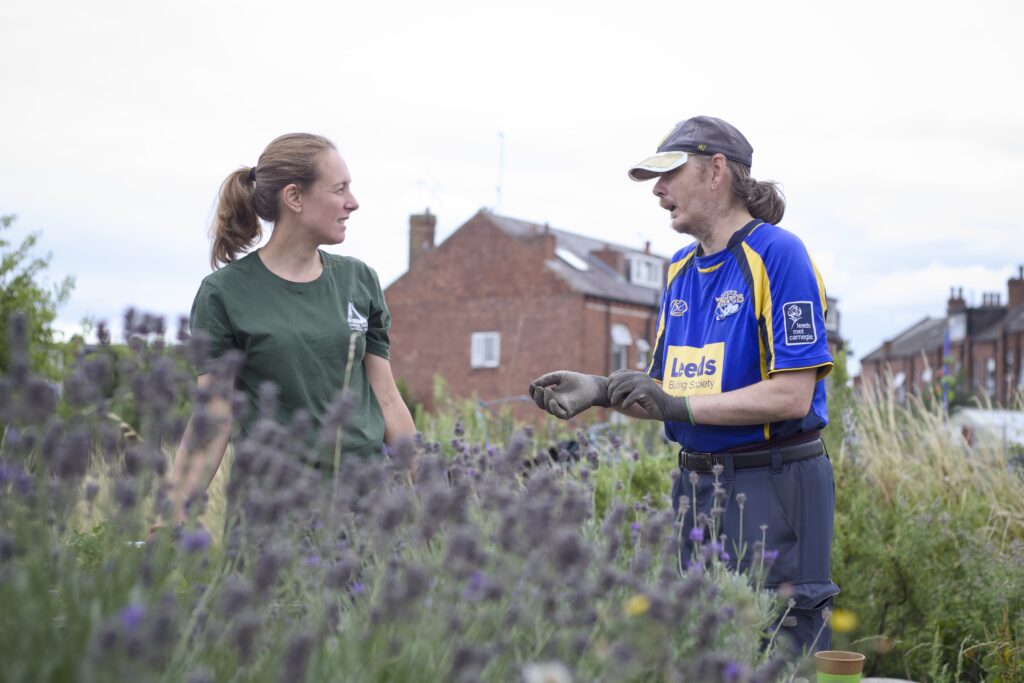 Photo of two people having a conversation outside