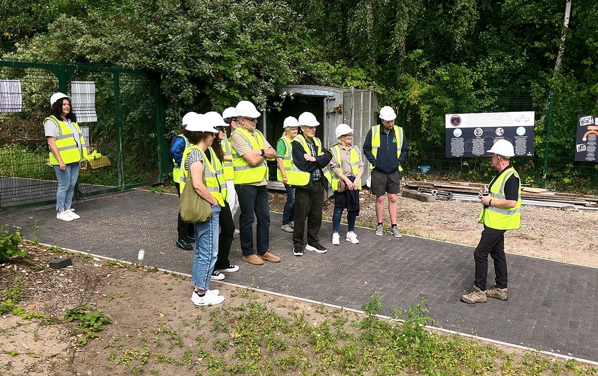 Visitors take a guided tour of the No. 7 Bottle Shop site.