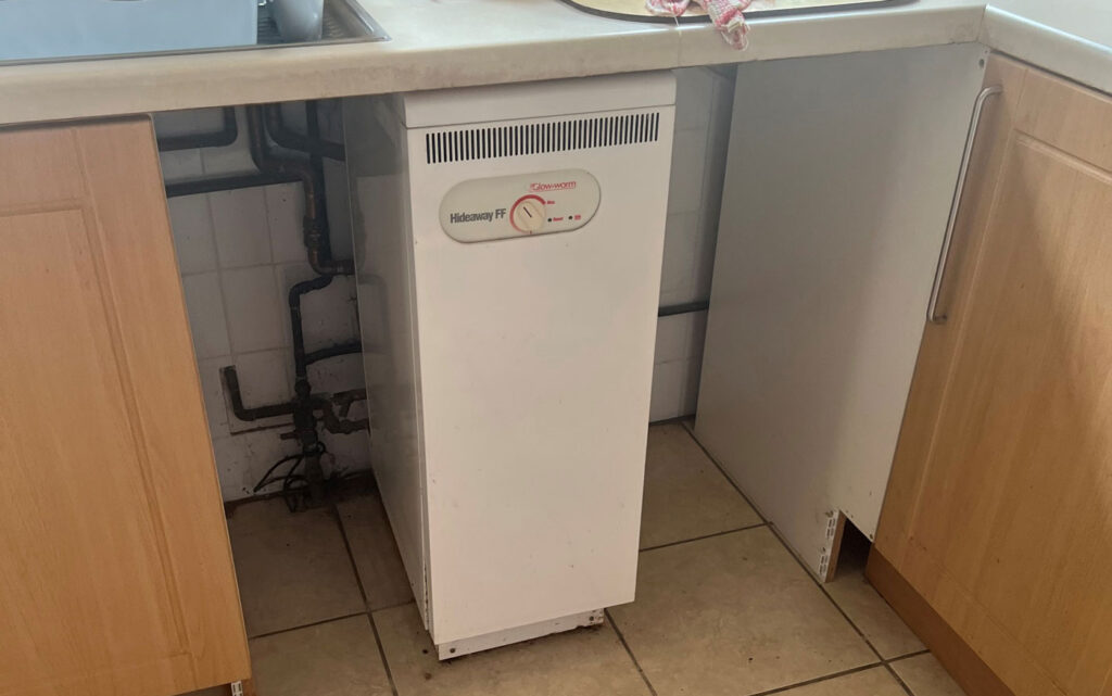 White appliance under kitchen counter