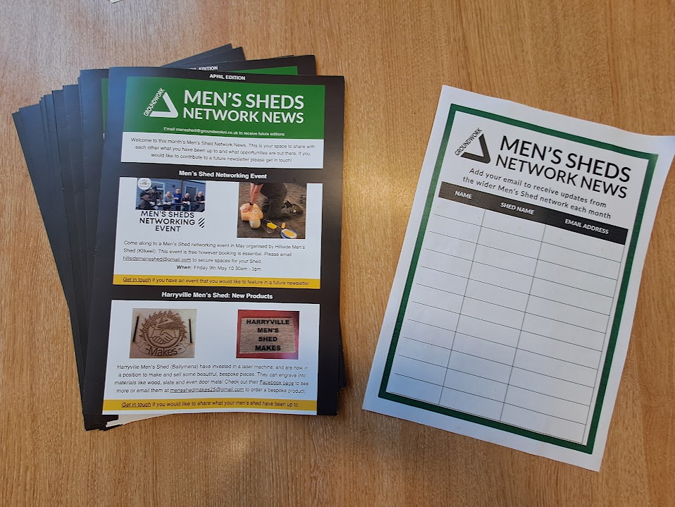 Men's Sheds Network News - stack of printed newsletters sitting on page