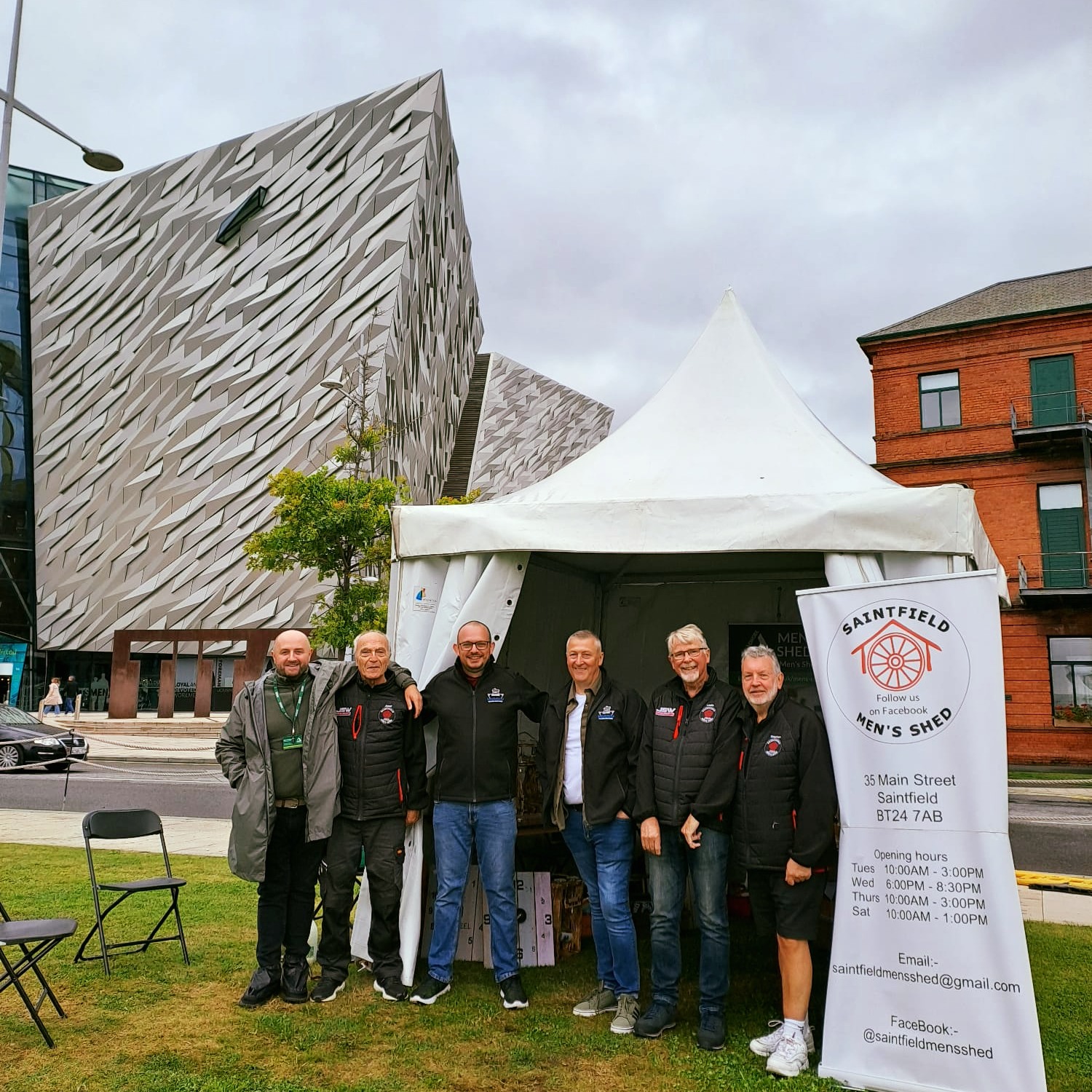 A group of me lined up in front of a gazebo beside the iconic Titanic Museum, Belfast