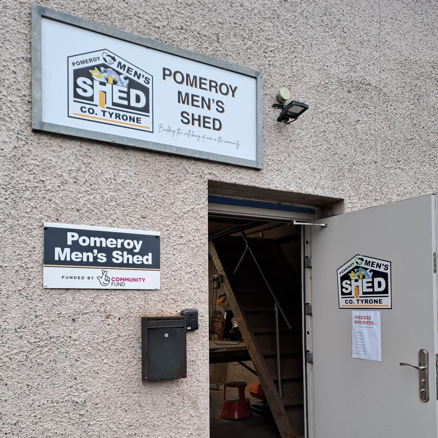 An open door with a sign saying "Pomeroy Men's Shed"