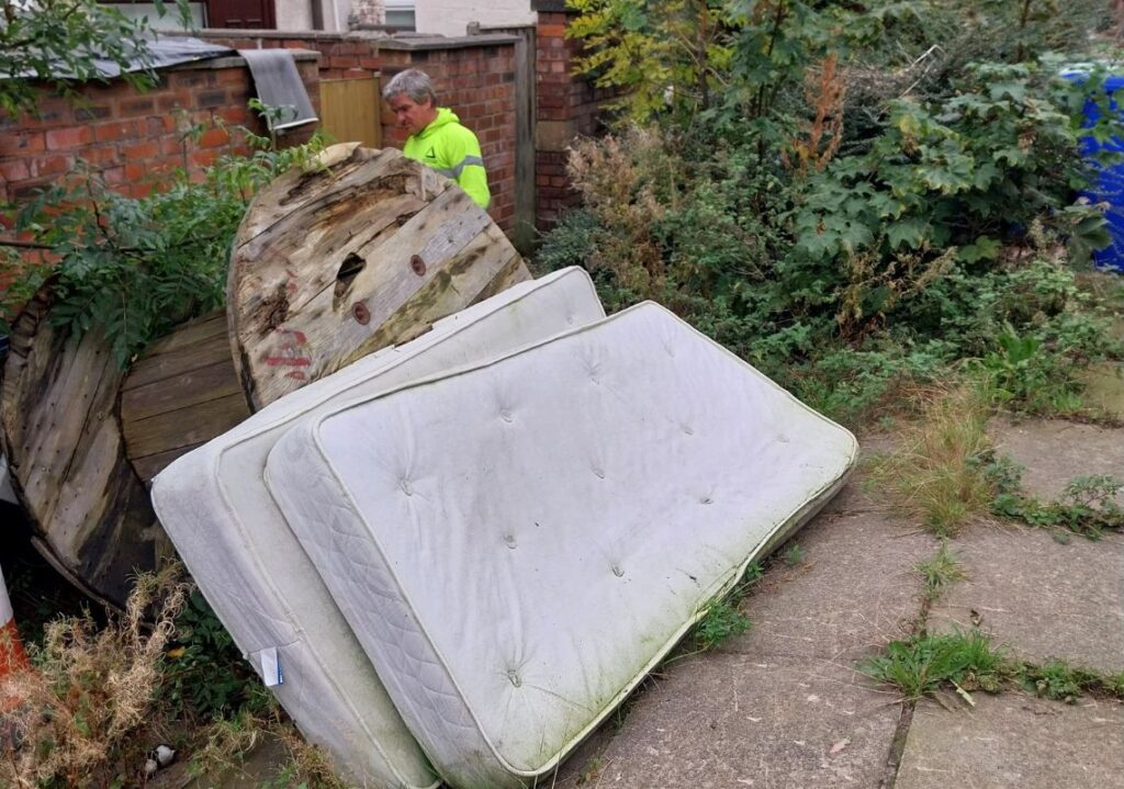 Removing litter as part of the Tameside Eco Streets project