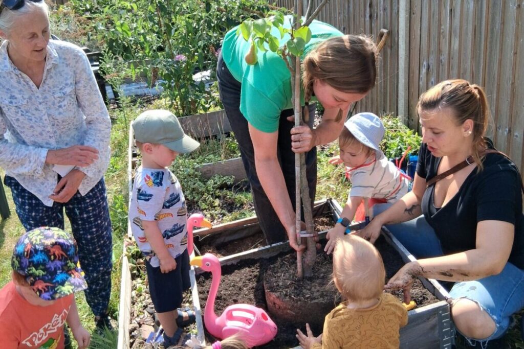 Families planting trees together