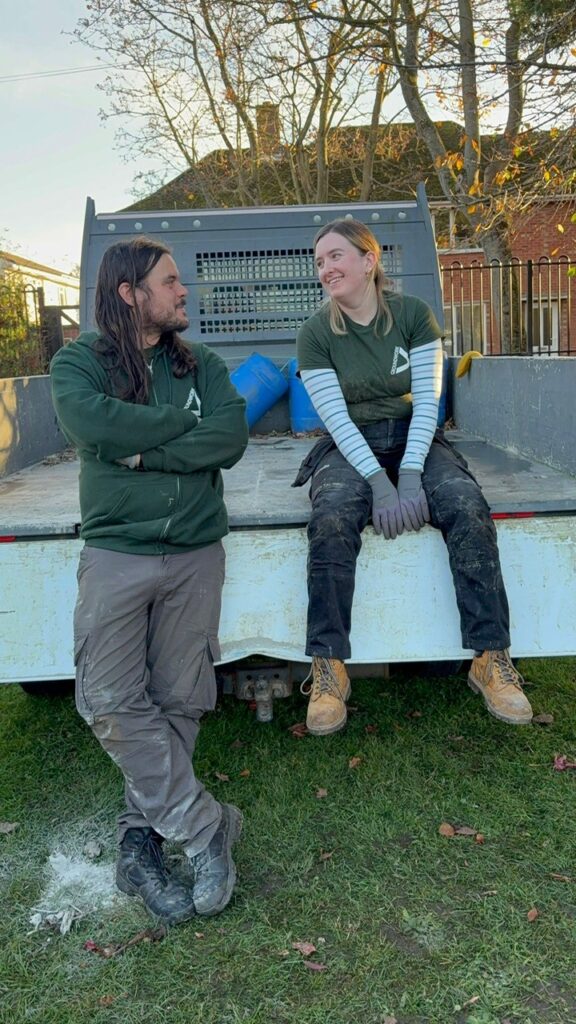Groundwork staff sitting in the back of a tipper truck