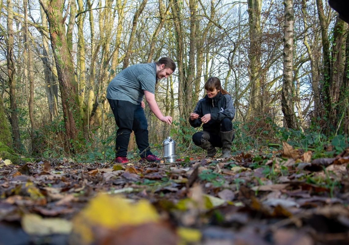 Young person using a kelly kettle