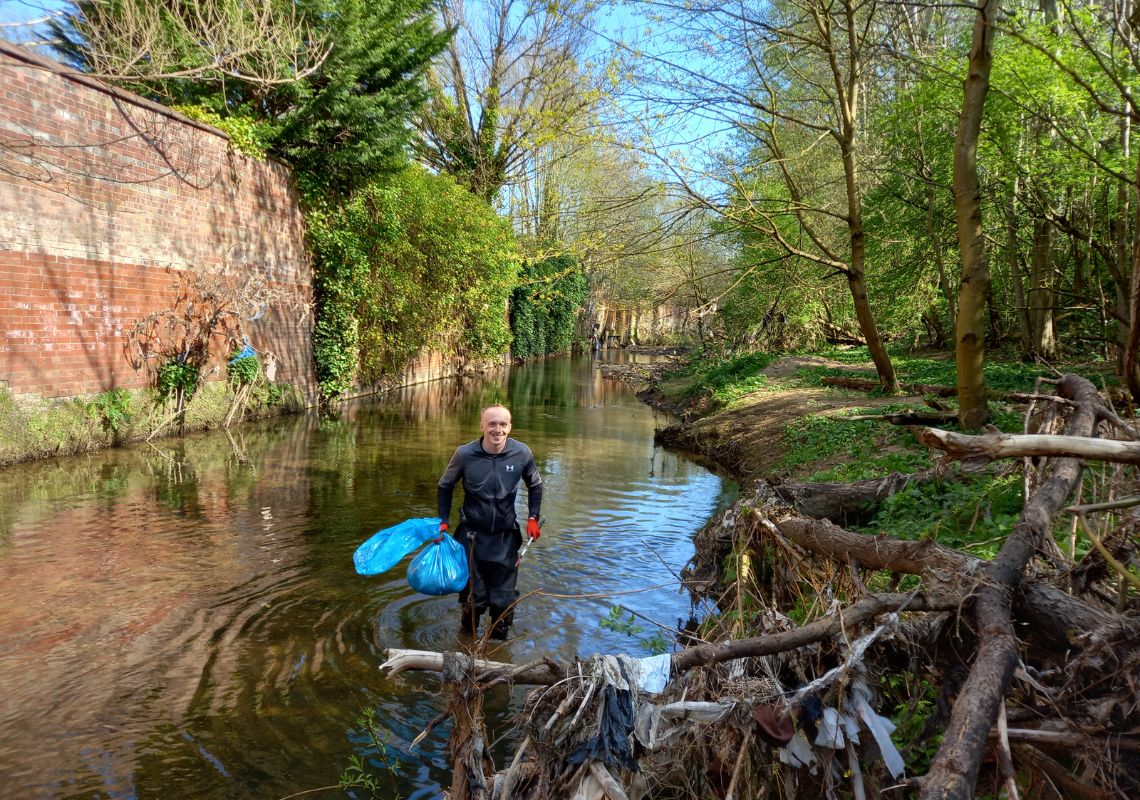 Travis litter picking in the Medlock Valley