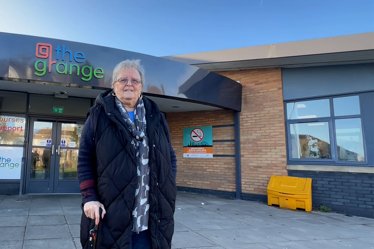 Sheila smiling outside @TheGrange community hub.