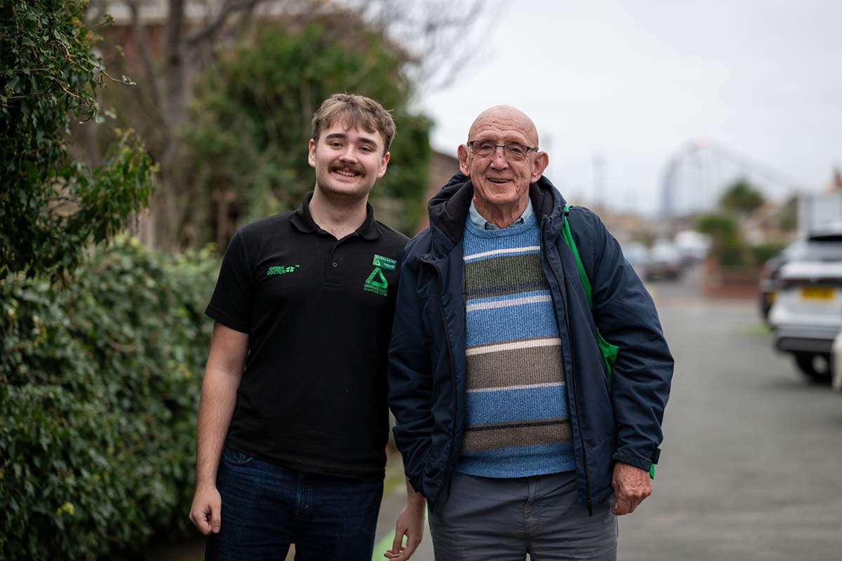Luke with a Blackpool resident benefitting from the Stay Warm Stay Well Campaign.