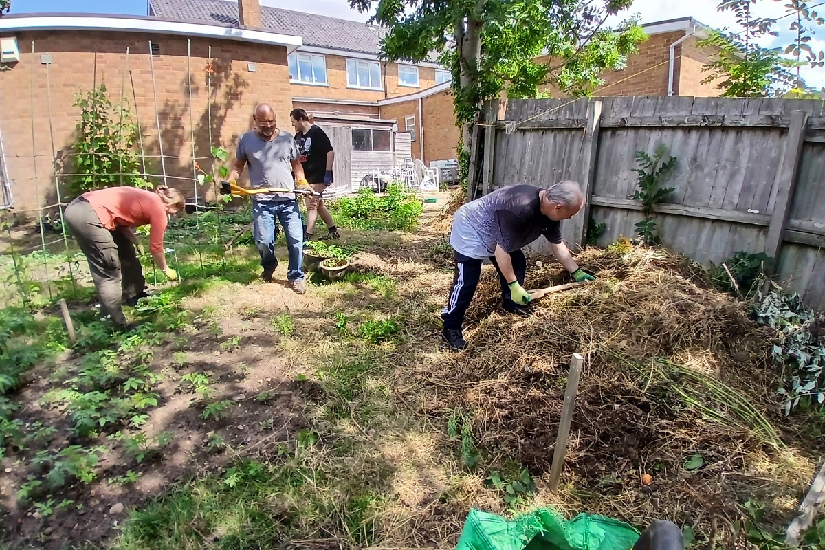 Volunteers working in a community garden