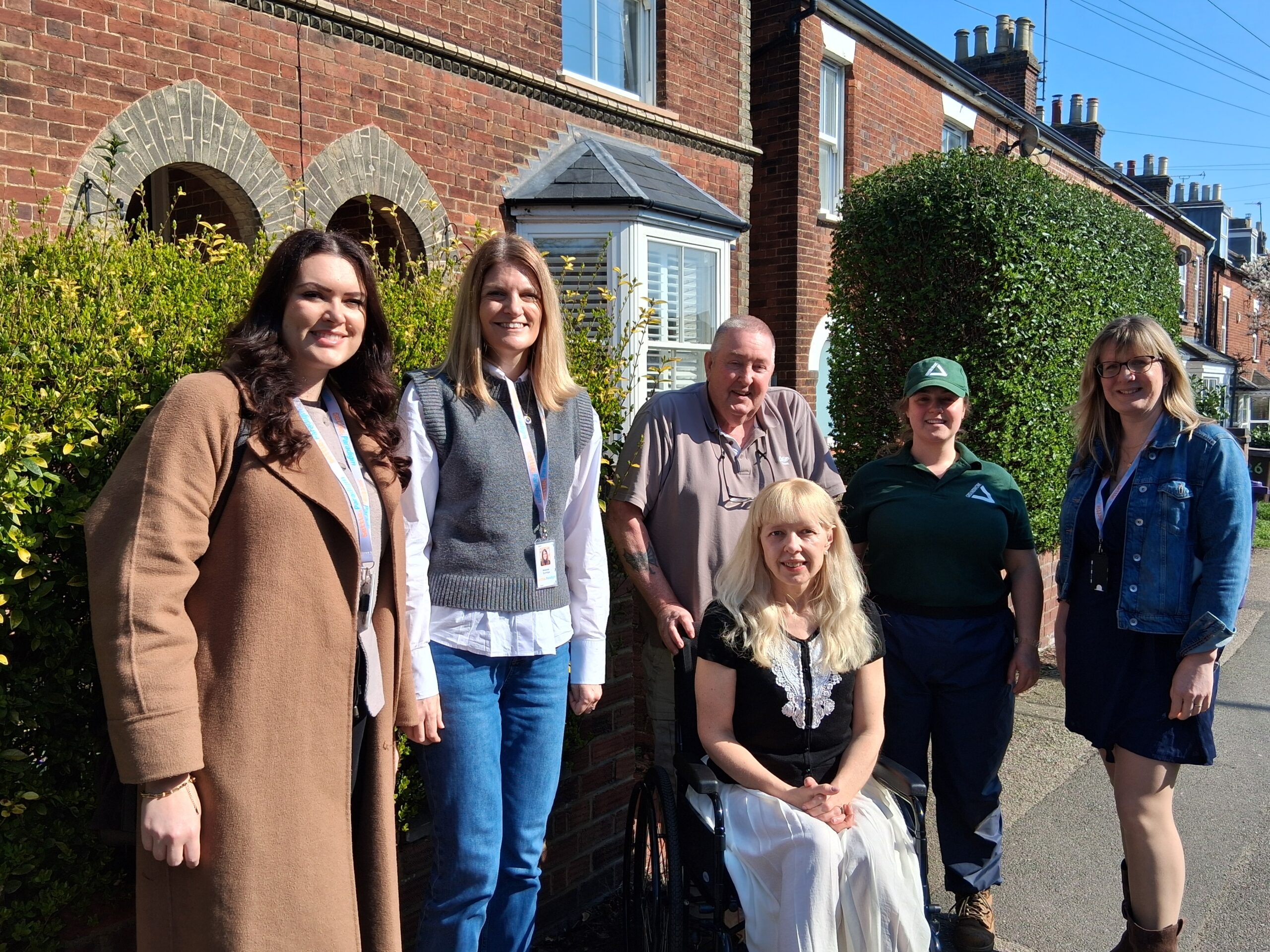 Group of people outside a house