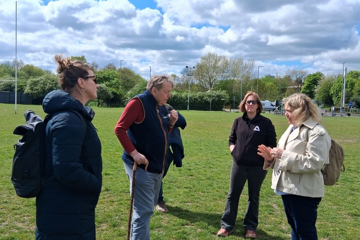 Marquess of Salisbury talking to Groundwork East staff in Knutsford playing field near River Colne