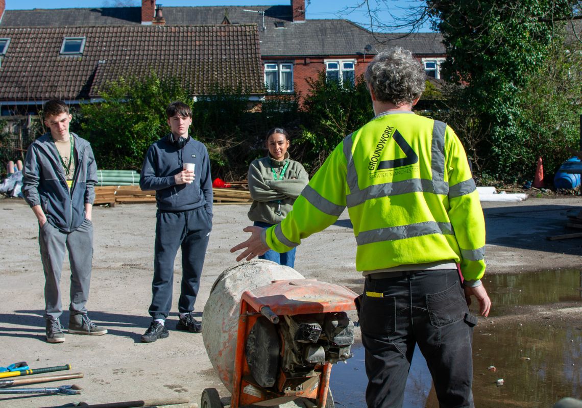 Adela and other participants receiving construction training 