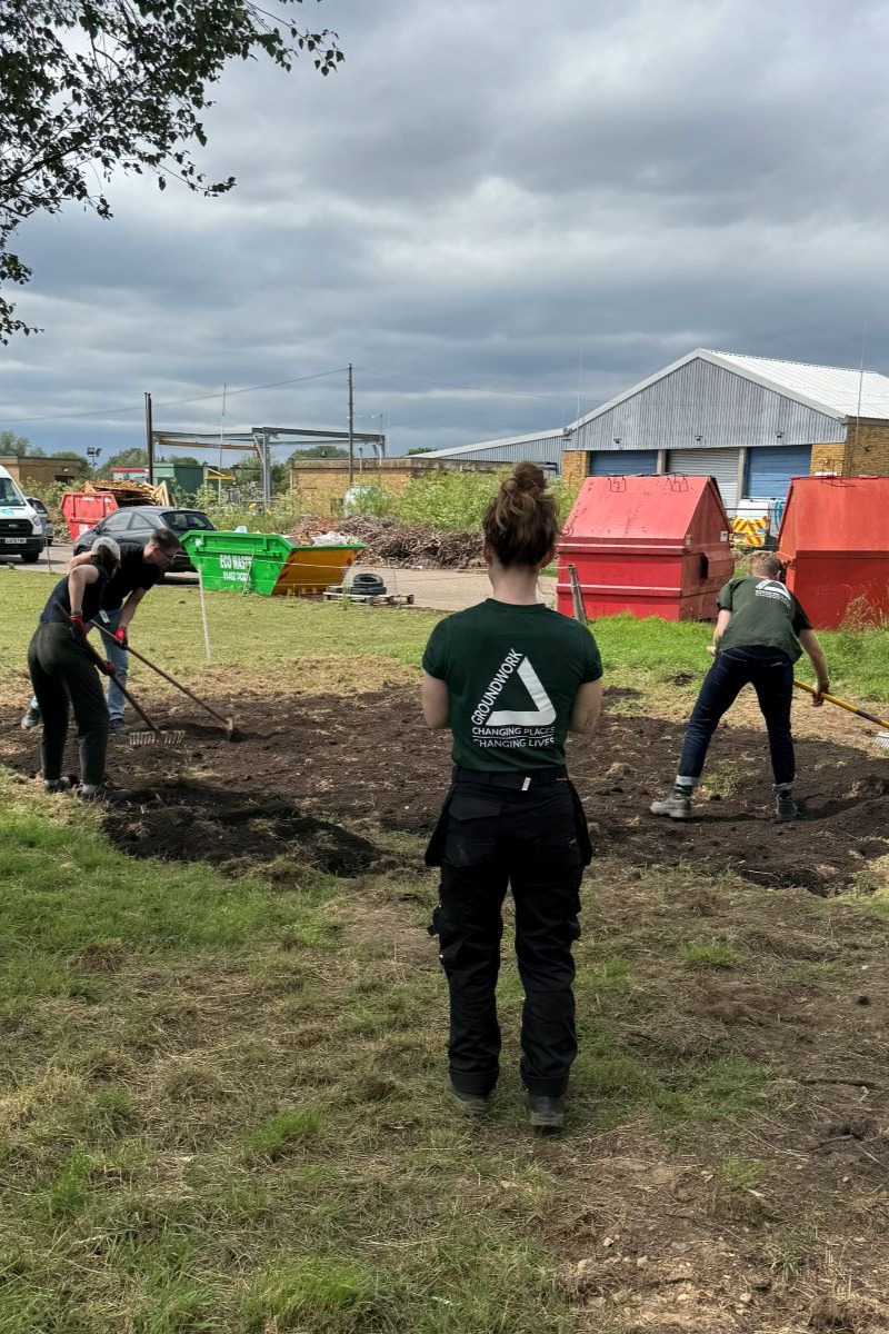 Volunteers creating base for raised beds