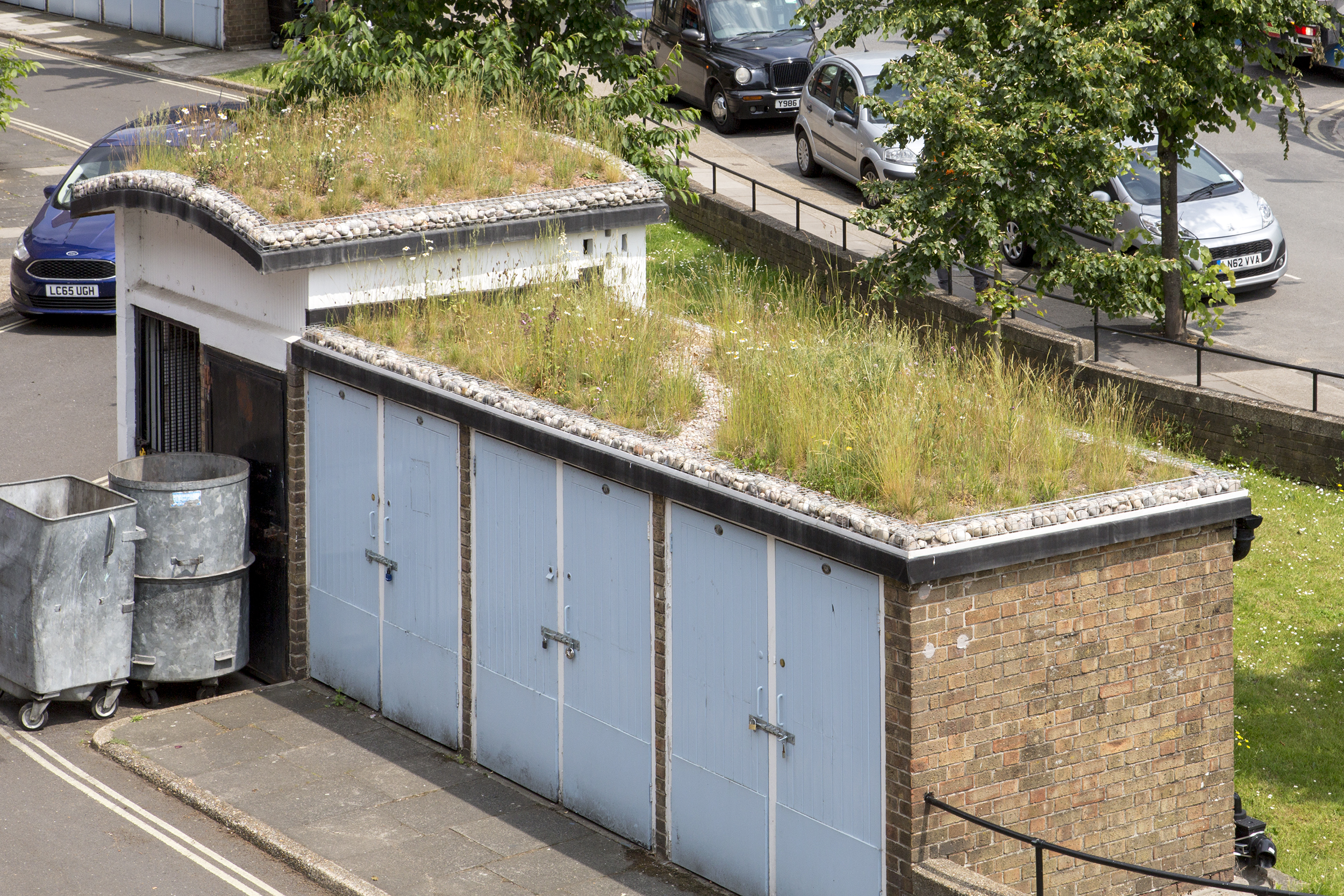 Green roofs help cool areas and create essential drainage to flat surfaces that are difficult to manage